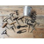 A SILVER PLATED BRITISH AIRWAYS CHAMPAGNE BUCKET AND A COLLECTION OF VINTAGE CORKSCREWS AND TIN