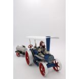 WILESCO LIVE STEAM ROLLER/TRACTION ENGINE, 30cm long, boxed as new with water cart trailer, 23cm