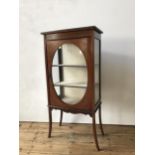 A VICTORIAN MAHOGANY INLAID GLAZED DISPLAY CABINET, with oval glazed central pane and hand painted