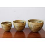 A SET OF THREE CONTEMPORARY GRADUATED LACQUERED BAMBOO PLANTERS, the largest 20cm high x 28cm dia
