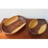 TWO CARVED INDIGENOUS WOODEN BOWLS, one obong and one oval, 42 x 32cm and smaller