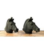 A PAIR OF RECONSTITUTED STONE HORSE'S HEAD PILLAR TOP ORNAMENTS, 54cm high x 66cm long