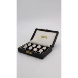 A SET OF BOXED SILVER PLATED MENU HOLDERS IN THE FORM OF OYSTER SHELLS