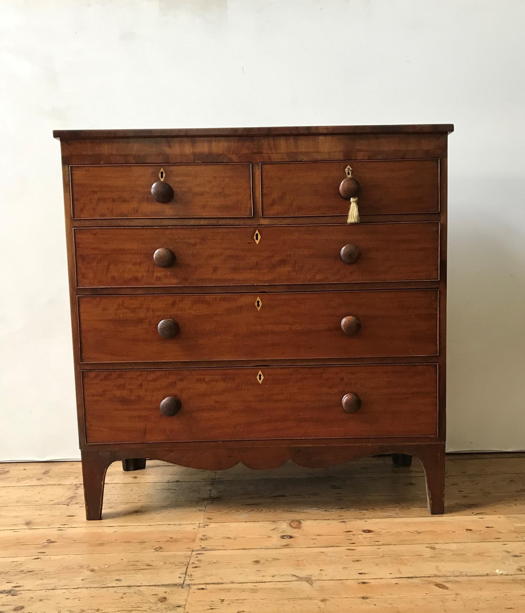 A 19th CENTURY MAHOGANY CHEST OF FIVE DRAWERS ON SPLAYED BRACKET FEET, two short drawers over