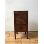 A GEORGE III MAHOGANY GENTLEMAN'S COMMODE, with fold-out top section, lifting mirror panel, drawer
