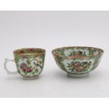 A PORCELAIN FAMILE ROSE DECORATED BOWL AND TEA CUP, the bowl measuring 12cm dia
