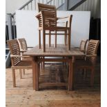 A GOOD QUALITY SLATTED TEAK PATIO TABLE AND SIX MATCHING CHAIRS WITH ARMS, the table measuring 76