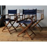 A SET OF FOUR FOLDING DIRECTOR'S STYLE GARDEN CHAIRS