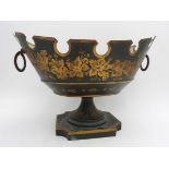 A TOLE WARE TAPERED PEDESTAL BOWL WITH HAND PAINTED FOLIATE DESIGN, castellated edge and two ring