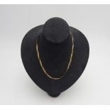 AN ITALIAN 9CT GOLD MULTI STRAND NECKLACE