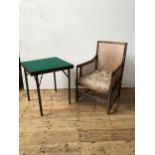 AN OAK FRAMED BERGERE CHAIR AND A FOLDING BRIDGE TABLE, the chair with cane panelled sides and