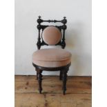 A VICTORIAN MAHOGANY CHILD'S CHAIR, on turned wooden legs, with turned pillar back supports and leaf