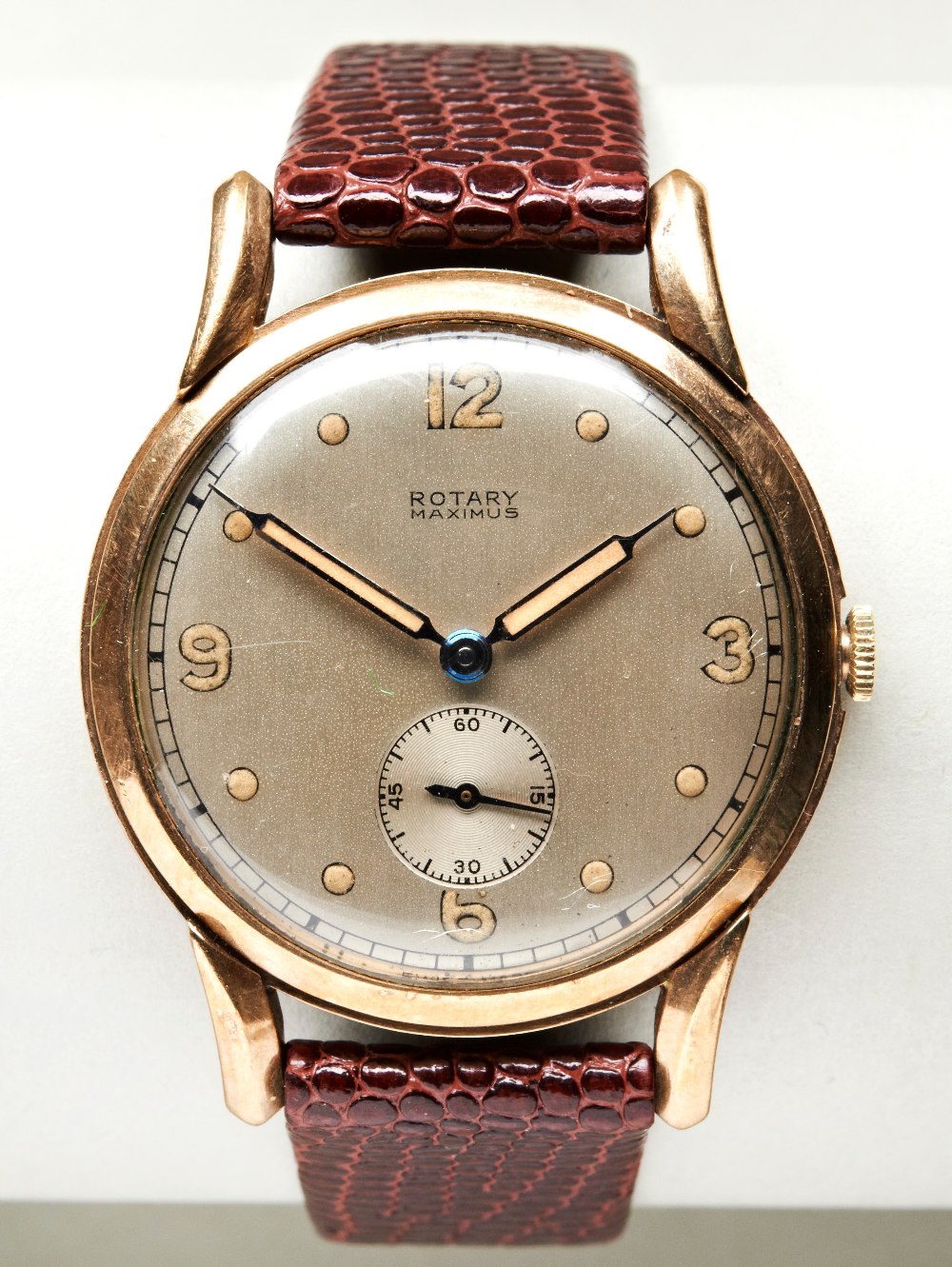 ROTARY MAXIMUS 9CT WATCH, c1952, the silvered dial with spot marks and Arabic  quarter numerals,