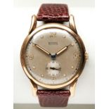 ROTARY MAXIMUS 9CT WATCH, c1952, the silvered dial with spot marks and Arabic  quarter numerals,