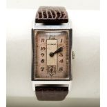 LANCO ART DECO MANUAL WIND STEEL TANK WRISTWATCH, with two-tone dial, raised Arabic gold numerals,
