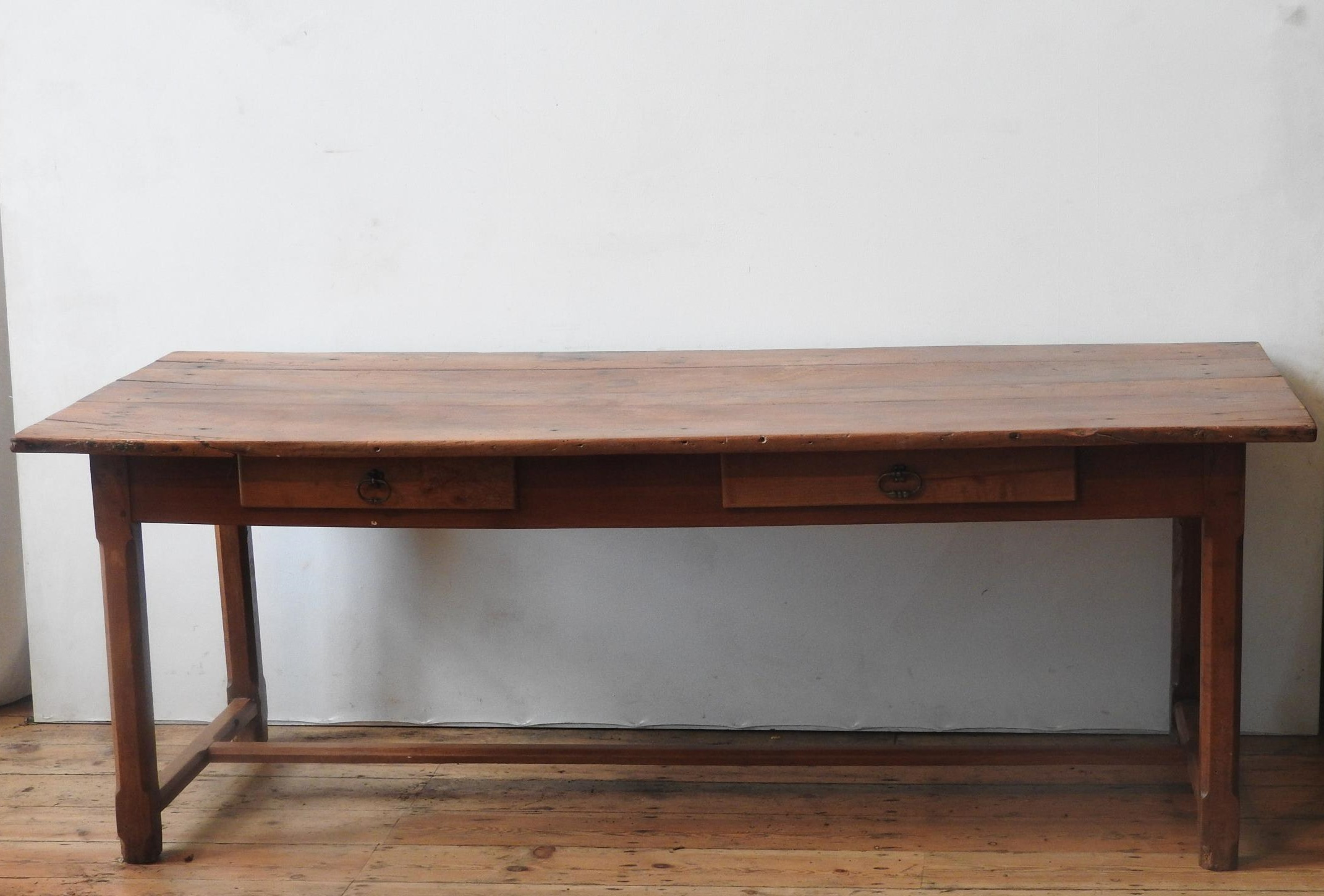 A 19TH CENTURY FRENCH FRUITWOOD FARMHOUSE TABLE WITH TWO DRAWERS, on a stretcher bar base, 72 x 82 x