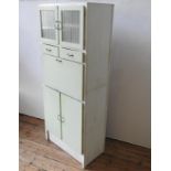 A VINTAGE GLAZED FALL-FRONT KITCHEN CABINET, with two drawers, two cupboard doors below and two