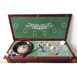A CASINO STYLE GAMES TABLE WITH ROULETTE WHEEL, BLACK JACK BOARD AND ACCESORIES, 88 x 119 x 52 cm