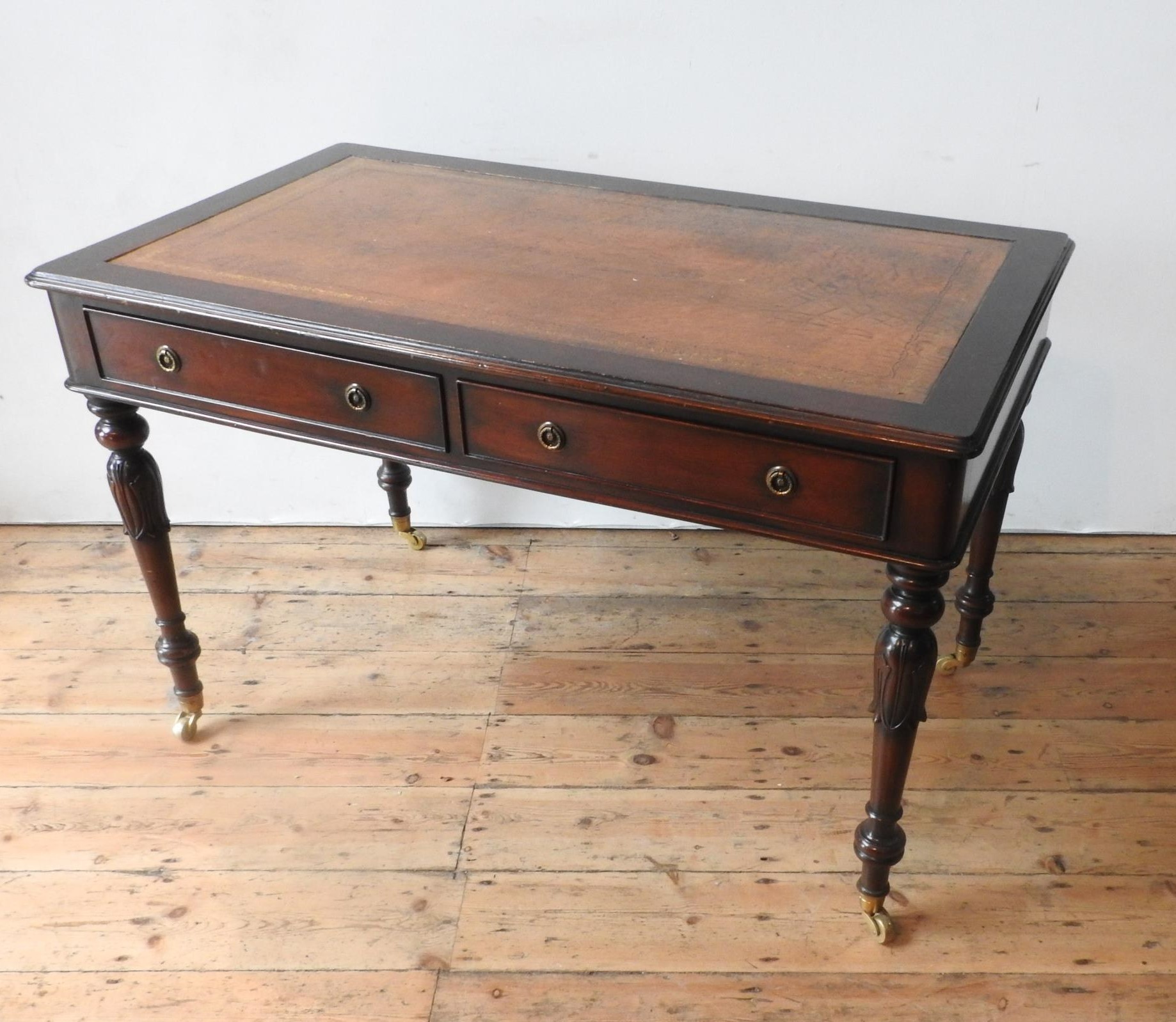 A 20TH CENTURY MAHOGANY REGENCY STYLE LIBRARY TABLE, with leather top, the legs carved with tulip - Image 2 of 3