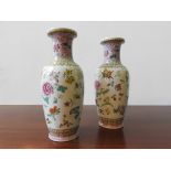 A PAIR OF REPUBLIC PERIOD VASES, with butterfly and floral decoration, 31 cm high