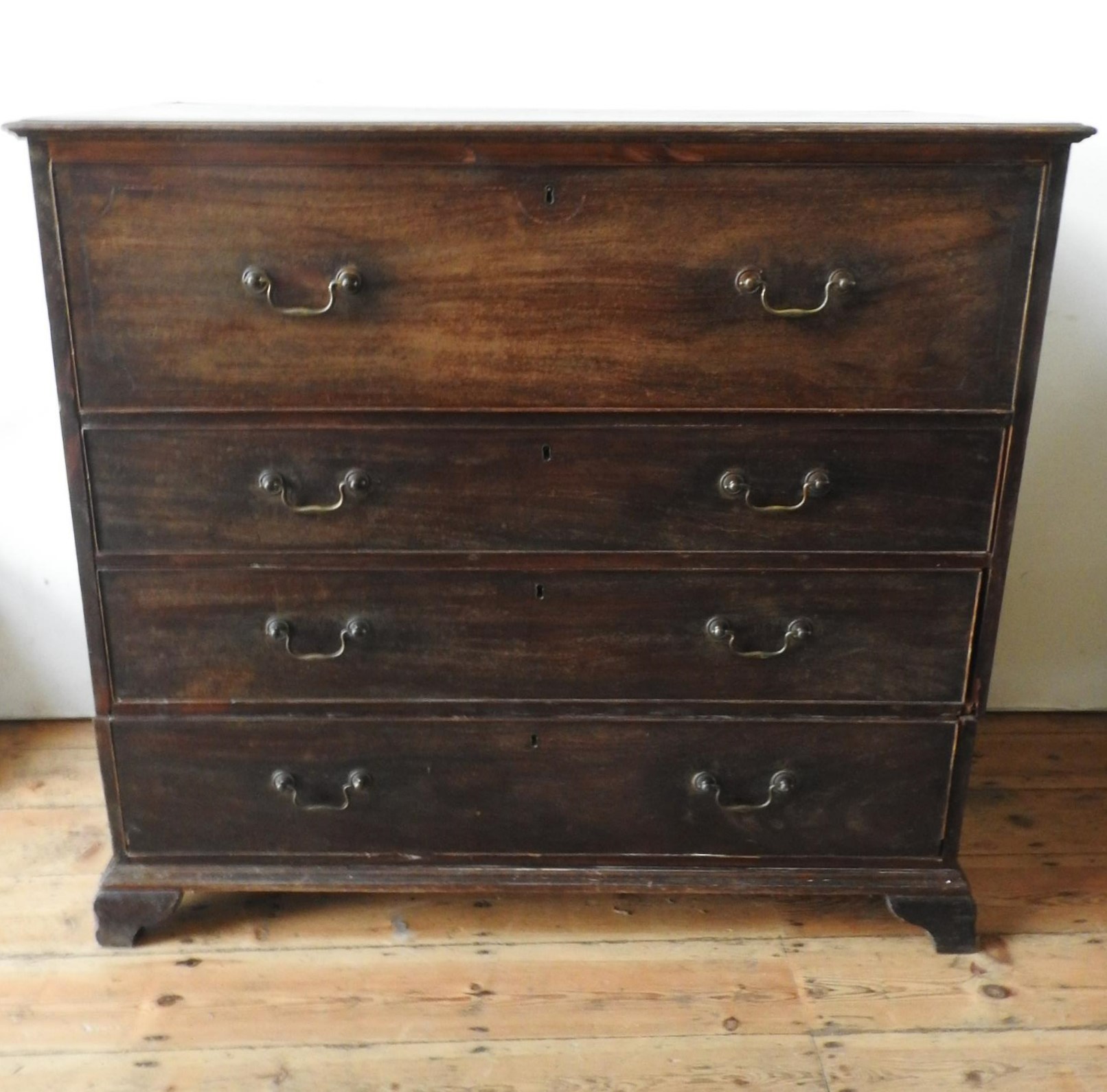 A 19th CENTURY MAHOGANY SECRETAIRE CHEST ON BRACKET FEET, the drop-front top drawer fitted with