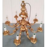 A BRASS DUTCH STYLE 8 BRANCH CHANDELIER (modern) 72 cm high, 80 cm diam Sold as non-functioning