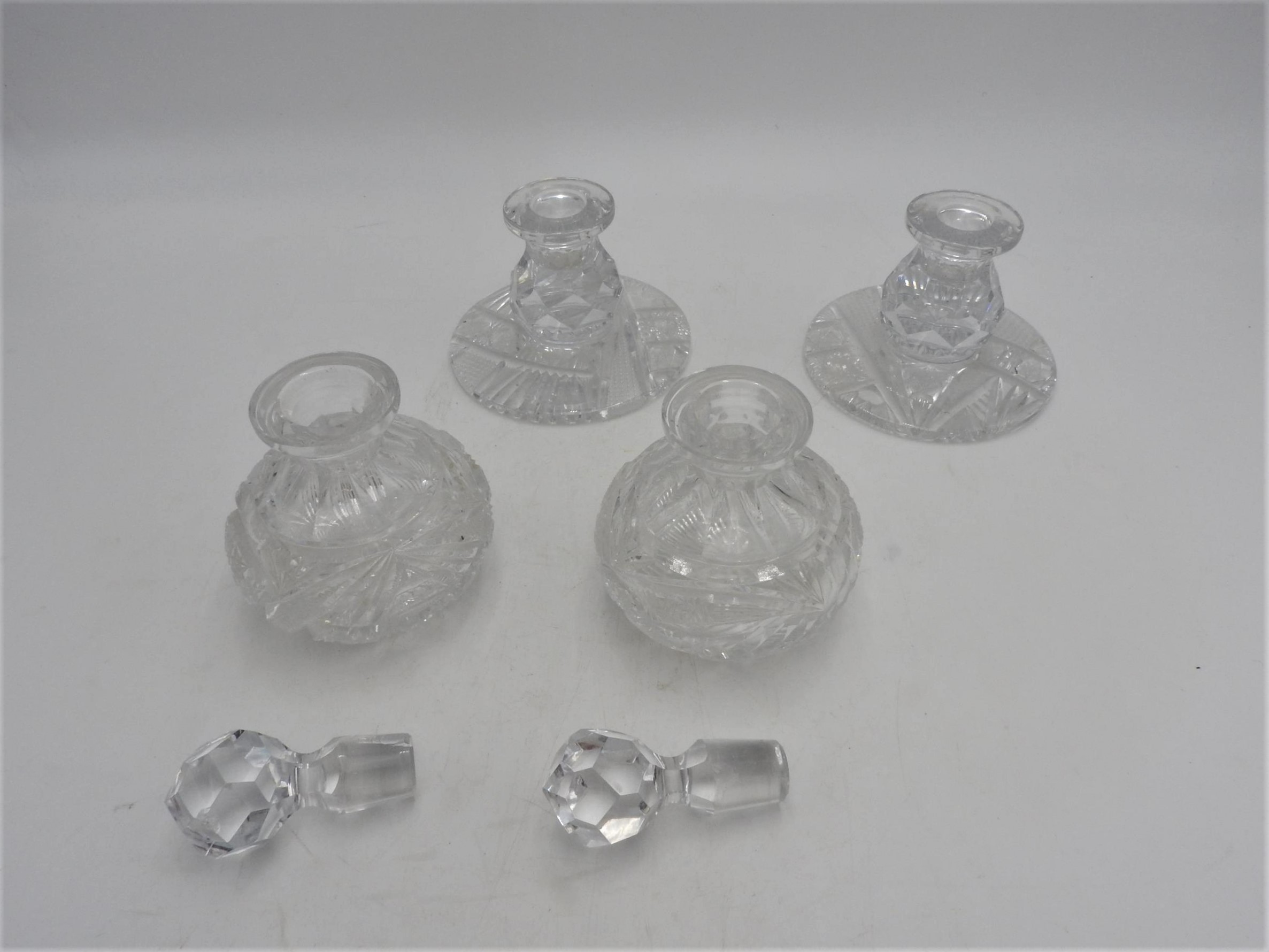A PAIR OF CUT GLASS SCENT BOTTLES AND A PAIR OF MATCHING CANDLESTICKS, the scent bottles measuring - Image 2 of 2
