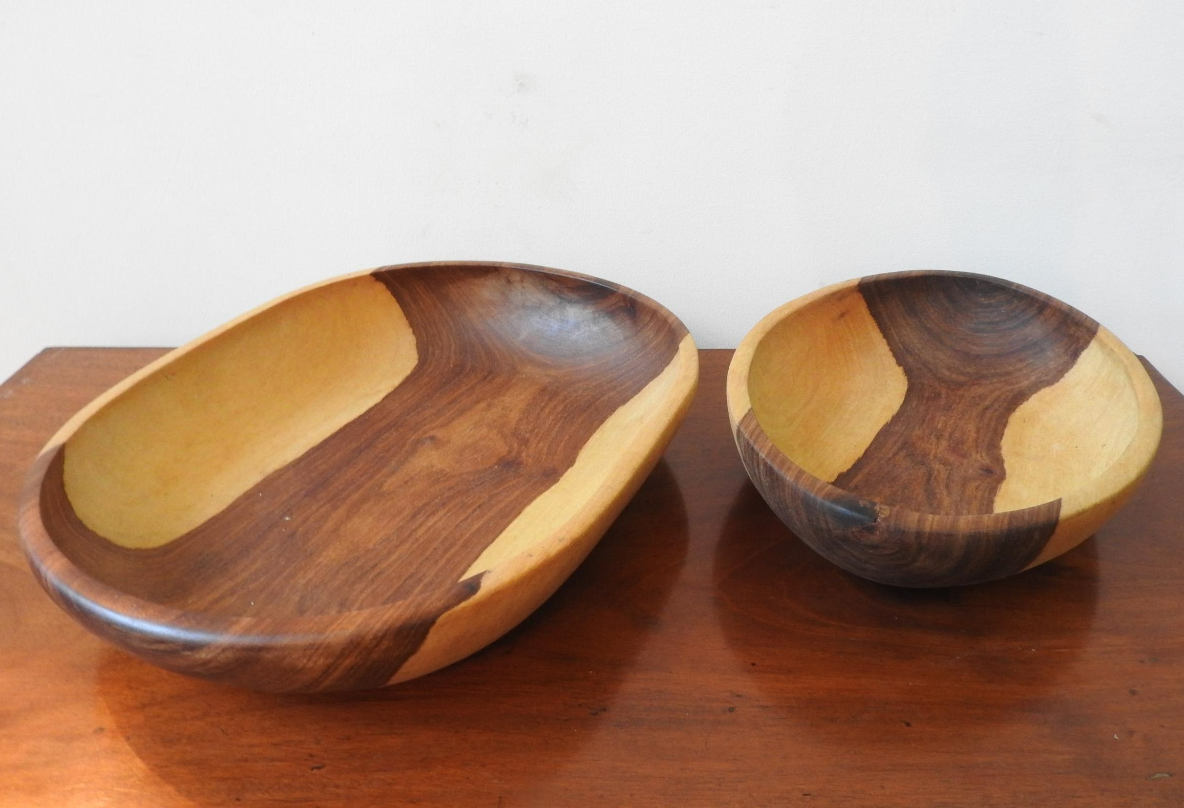 TWO CARVED INDIGENOUS WOODEN BOWLS, one obong and one oval, 42 x 32cm and smaller - Image 2 of 3