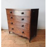 A LATE GEORGE III MAHOGANY CROSS BANDED CHEST OF FOUR DRAWERS, on splayed bracket feet with four