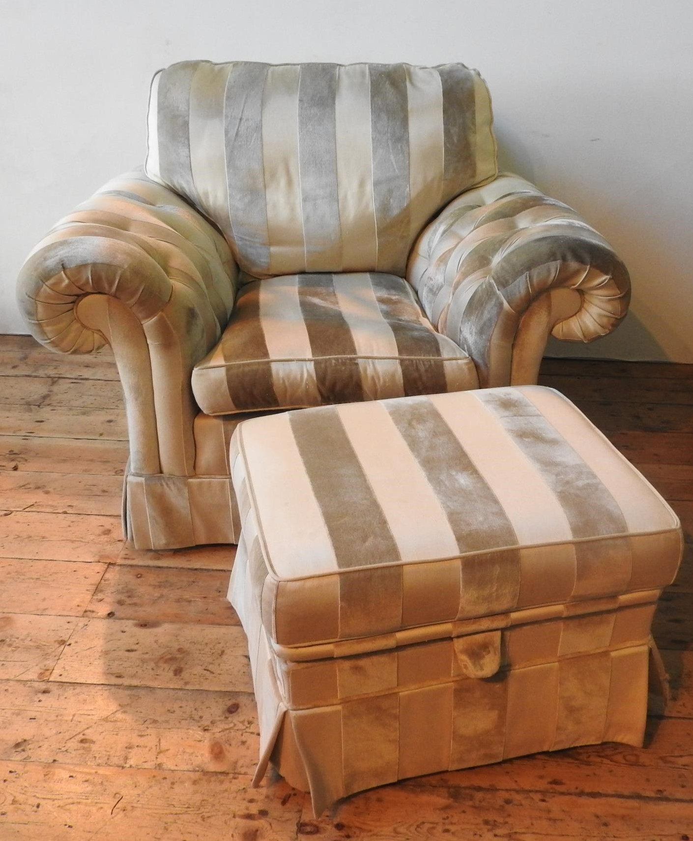 A DURESTA STRIPED BUTTON UPHOLSTERED ARMCHAIR AND MATCHING FOOT STOOL, the chair measures 100 x