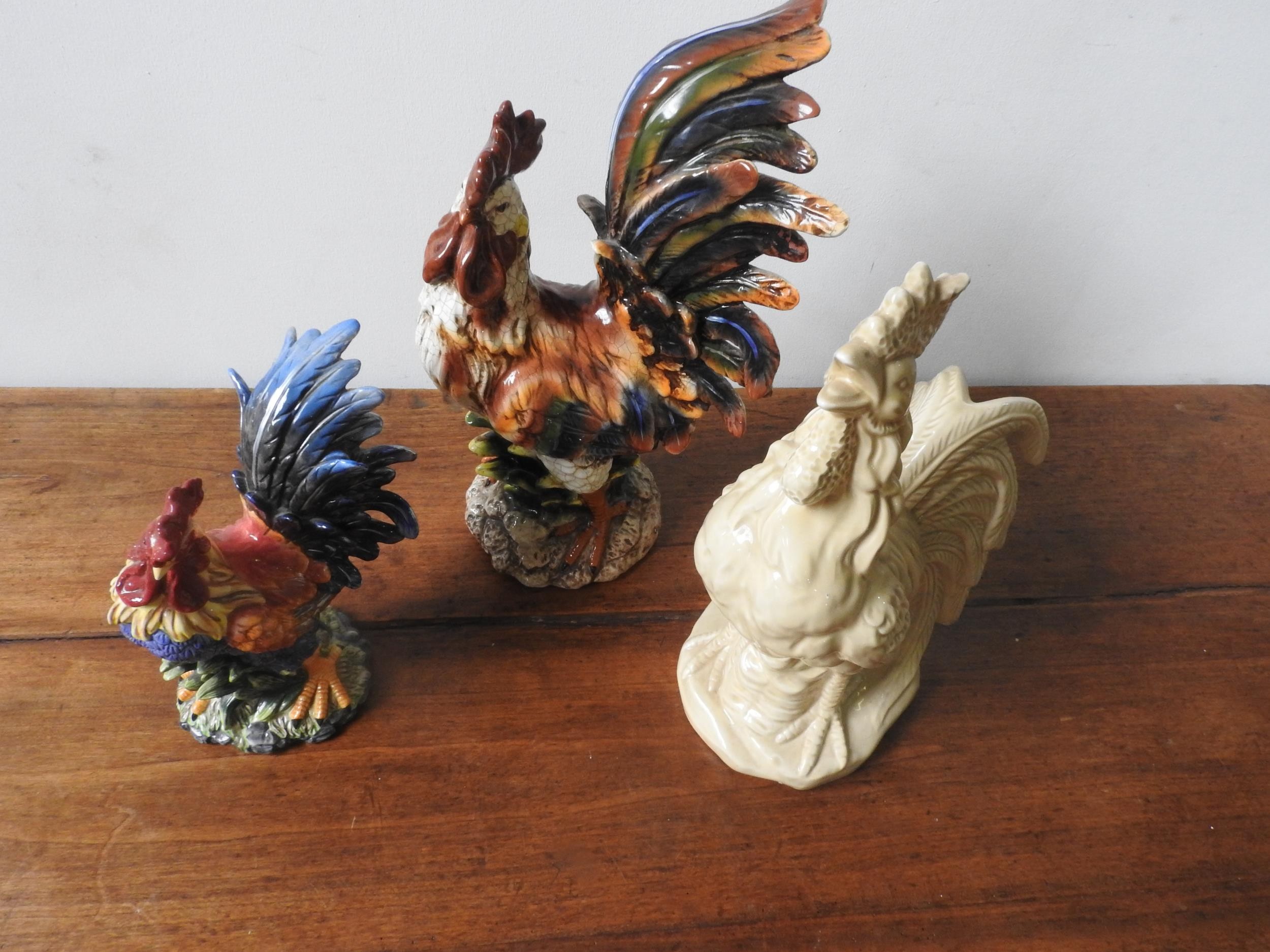 THREE 20TH CENTURY GLAZED COCKEREL ORNAMENTS, two painted and one cream glazed, the largest 48 cm - Image 2 of 2