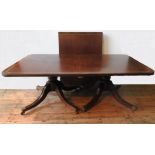 A 20TH CENTURY TWIN PEDEDSTAL D-END CROSS BANDED DINING TABLE AND 6 DINING CHAIRS, with tilting