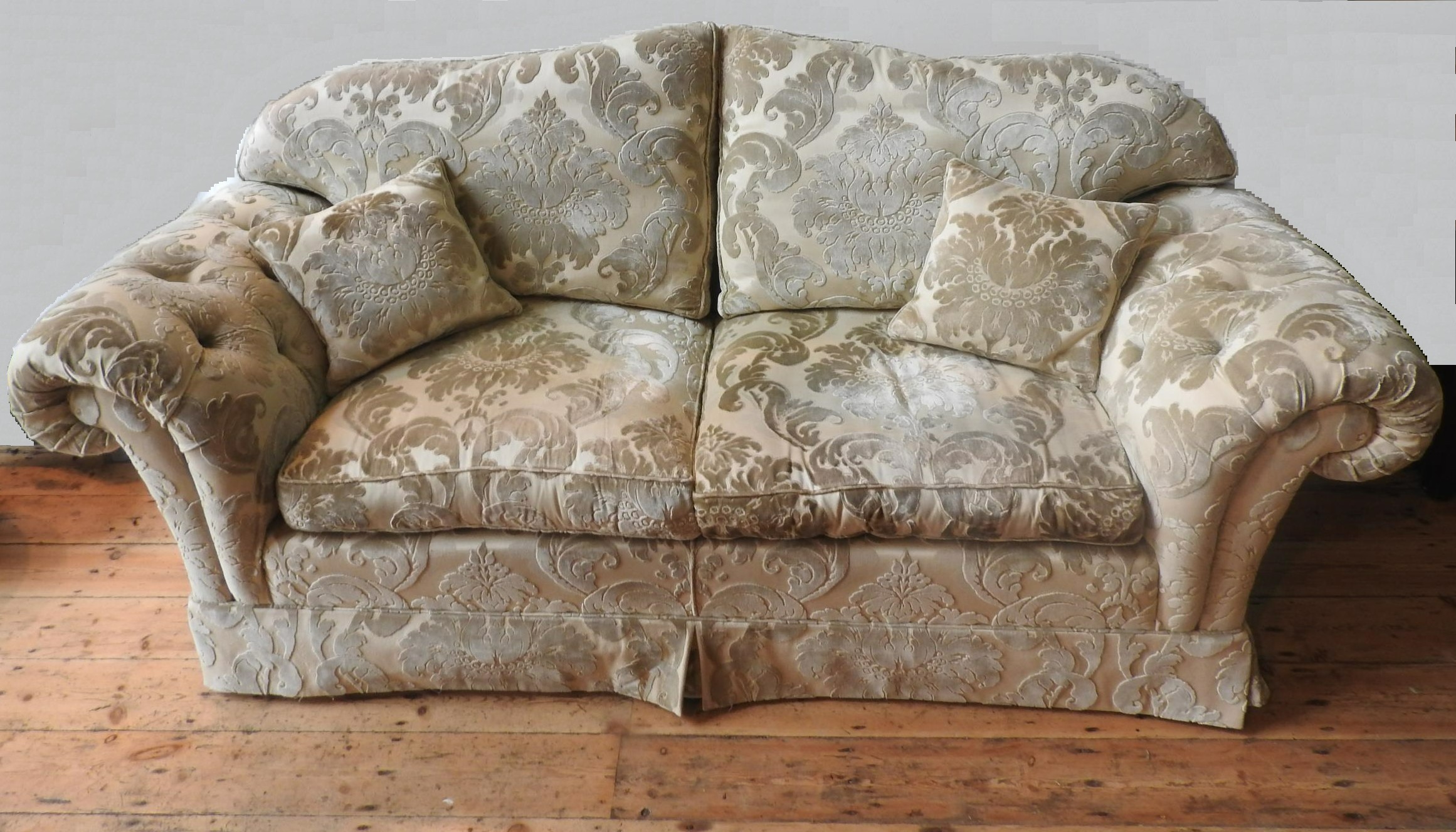 A LARGE BROCADE UPHOLSTERED THREE SEAT SOFA AND MATCHING SOFA,with scroll arms, foliate brocade