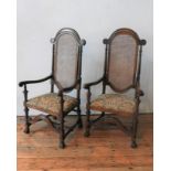A PAIR OF 17th CENTURY STYLE OAK CANE PANEL BACK CHAIRS, with scroll arms, claw feet and ornate