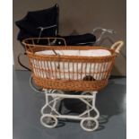 A WILSON 'COACH BUILT' PRAM WITH DARK BLUE LIVERY, curved coach springs and pull-over fabric hood