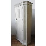 A 20TH CENTURY CREAM PAINTED NARROW WARDROBE, with linen fold detail and canted corners, 186 x 96