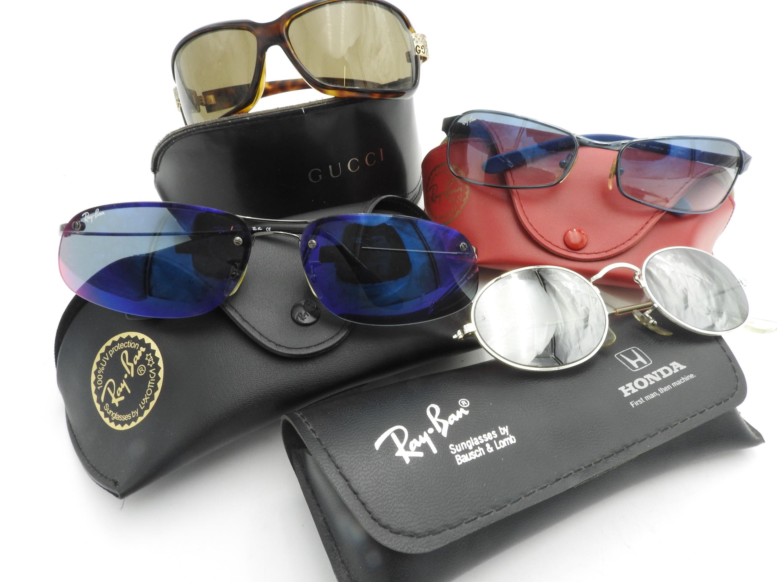 A PAIR OF GUCCI SUNGLASSES AND THREE PAIRS OF RAY-BAN SUNGLASSES