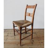 A RUSTIC RUSH SEAT SINGLE COUNTRY CHAIR