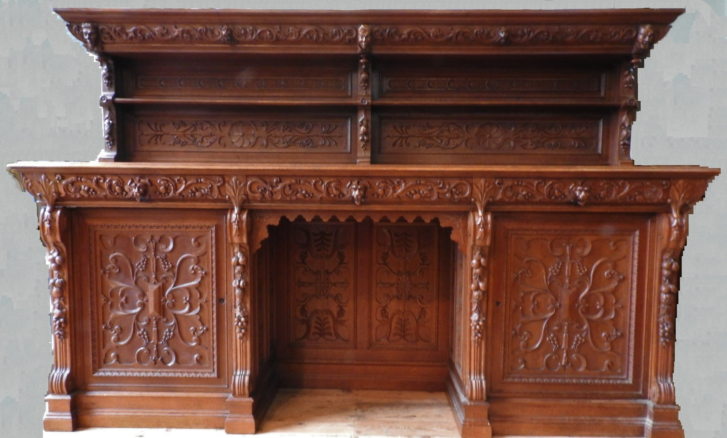 AN ORNATE CARVED OAK 19TH CENTURY CONTINENTAL SIDEBOARD, consisting of of an ornate carved back