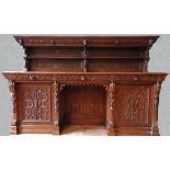 AN ORNATE CARVED OAK 19TH CENTURY CONTINENTAL SIDEBOARD, consisting of of an ornate carved back