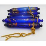 FIVE EARLY 19TH CENTURY COMMEMORATIVE BRISTOL COBALT BLUE GLASS NAVAL ROLLING PINS, 33 cm long