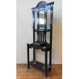 AN OAK ART NOUVEAU HALL STAND WITH MIRRORED BACK PANEL, hammered cast-metal coat hooks, the top