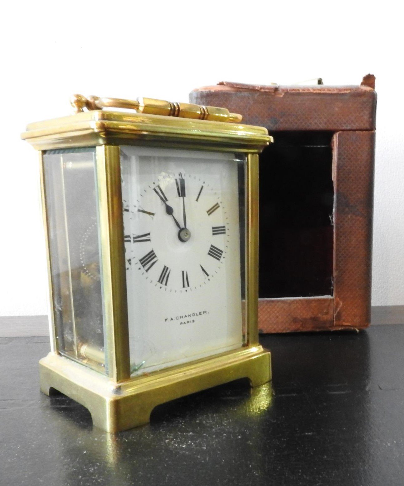 A FRENCH BRASS CARRIAGE CLOCK WITH CARRY CASE AND KEY, inscribed F.A Chandler, Paris, 15 cm high