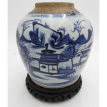 A CHINESE BLUE AND WHITE GLAZED GINGER JAR WITH CARVED WOODEN STAND, the jar stands 18cm high