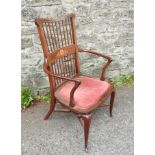 A 19TH CENTURY MAHOGANY SPINDLE BACK ELBOW CHAIR, with marquetry inlay