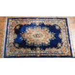 A BLUE AND FAWN EMBOSSED CHINESE WASH CARPET, 184 x 280 cm