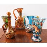 THREE CONTINENTAL OVERPAINTED COLOURED GLASS VASES, DECANTER AND JUG, the jug measuring 30 cm high
