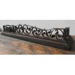 A CAST-IRON ORNATE FOLIATE PATTERN FIRE CURB