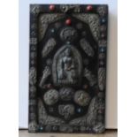 A 19TH CENTURY TIBETAN WOODEN PANEL DECORATED WITH BUDDHA AND DRAGON MOTIFS, the motifs in cast
