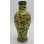 A 19TH CENTURY FAMILLE ROSE YELLOW GLAZED BALUSTER VASE, 25 cm high